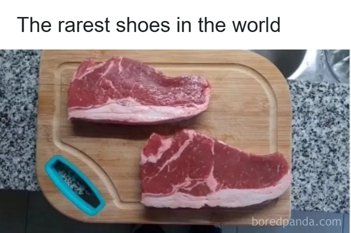Two raw steaks on a wooden cutting board resembling the shape of rare shoes in entertaining meme format.