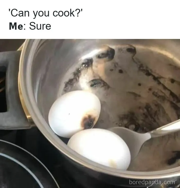Burnt eggs in a pot with a spoon, illustrating cooking fail meme related to entertaining memes you might need to function.