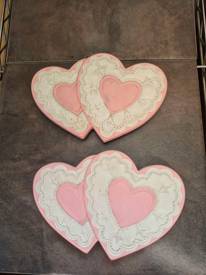 Heart-shaped decorated cookies on a dark surface illustrating eerie and odd experiences of unexplained people stories.