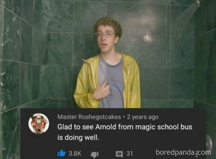 A person in a yellow jacket under a shower, with a comment comparing them to Arnold from Magic School Bus. Rare burns.