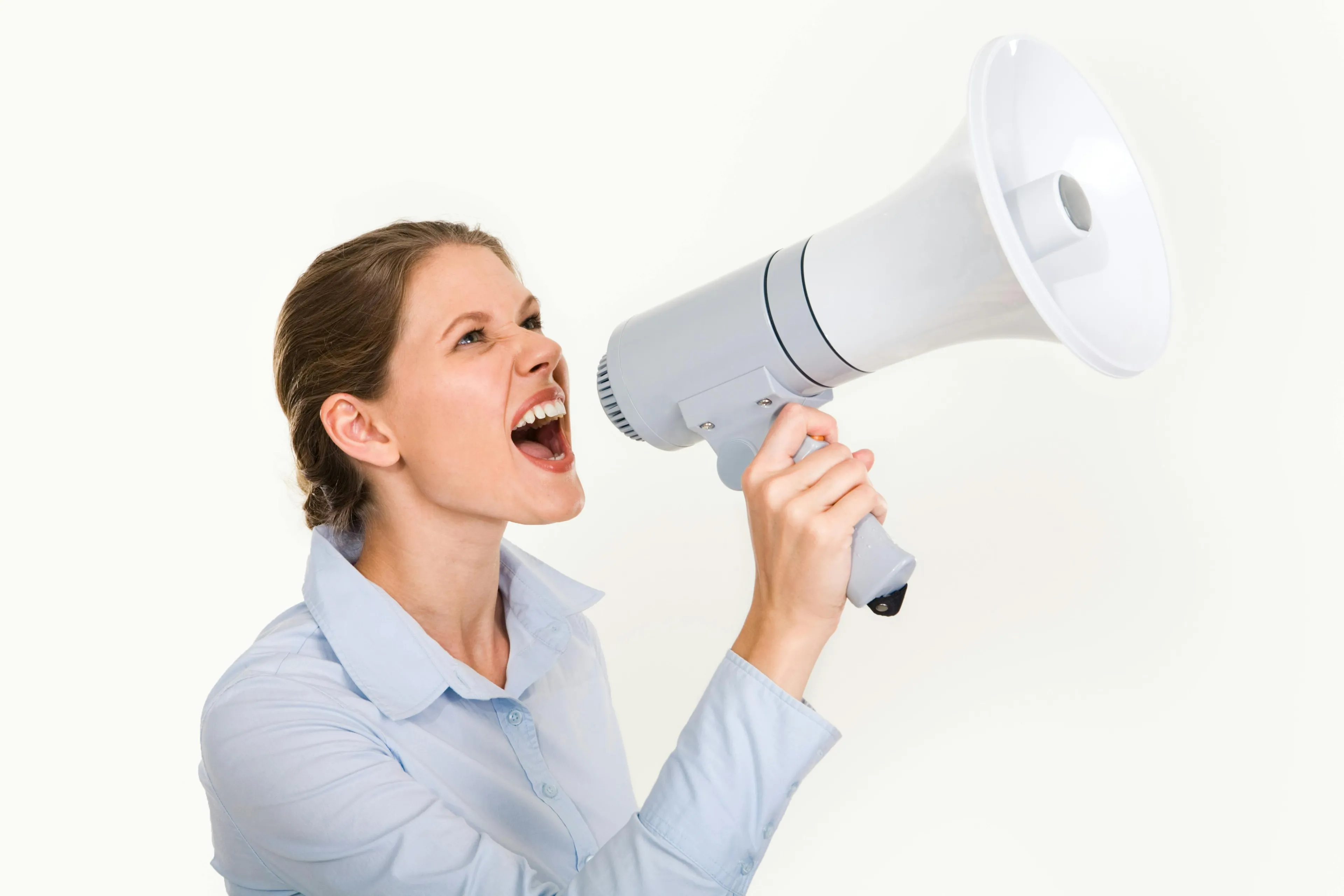 Woman shouting into a megaphone, symbolizing discovering your courage meter when facing a loud neighbor.