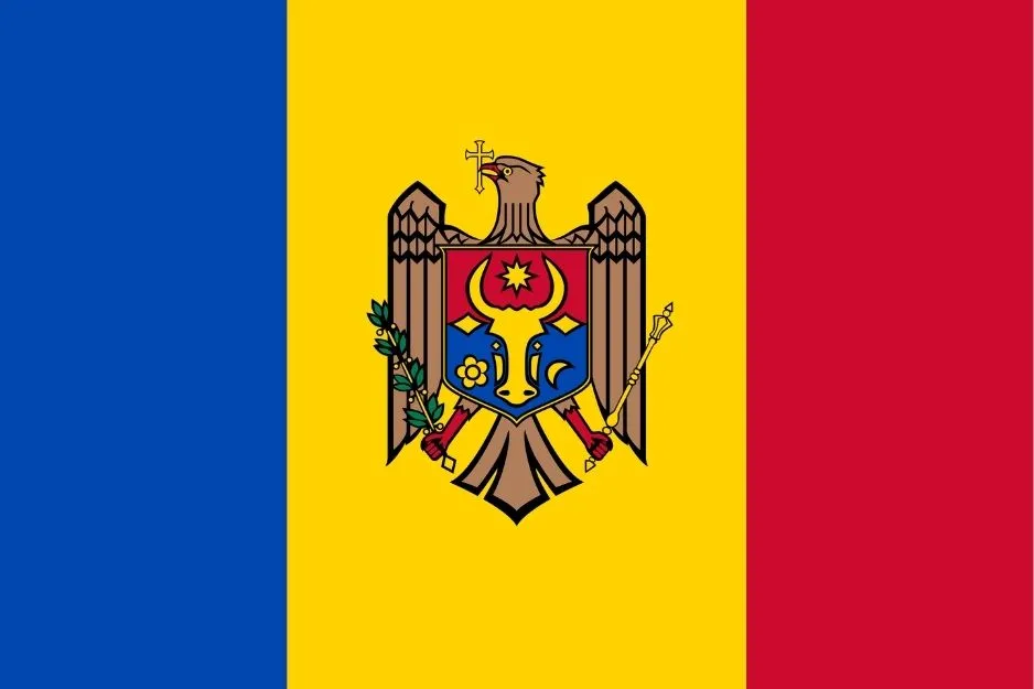 Flag with vertical blue, yellow, and red stripes and a coat of arms in the center, not the flag of Chad.