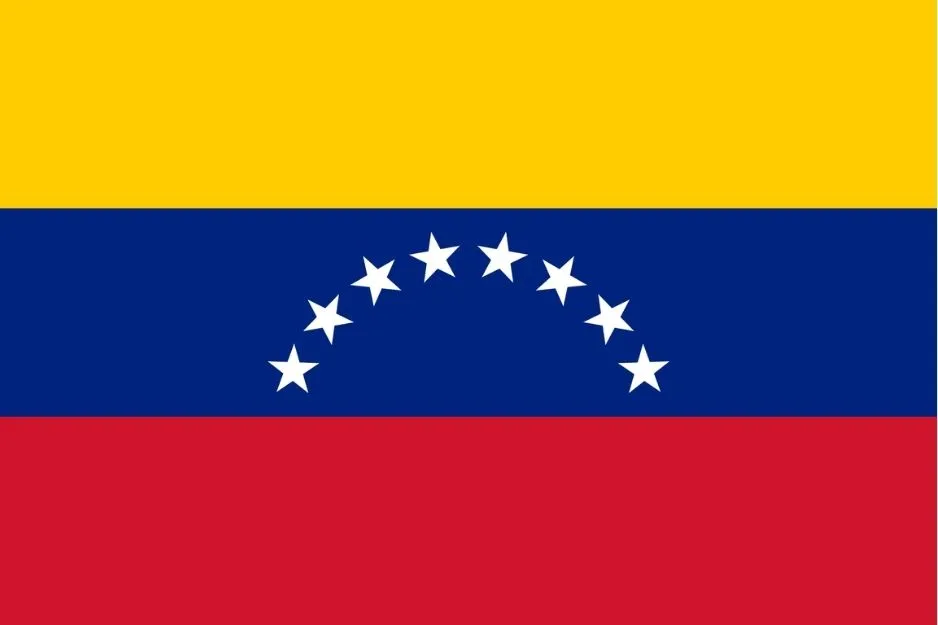 Venezuela's flag with yellow, blue, and red horizontal stripes and a curved row of white stars on the blue stripe.