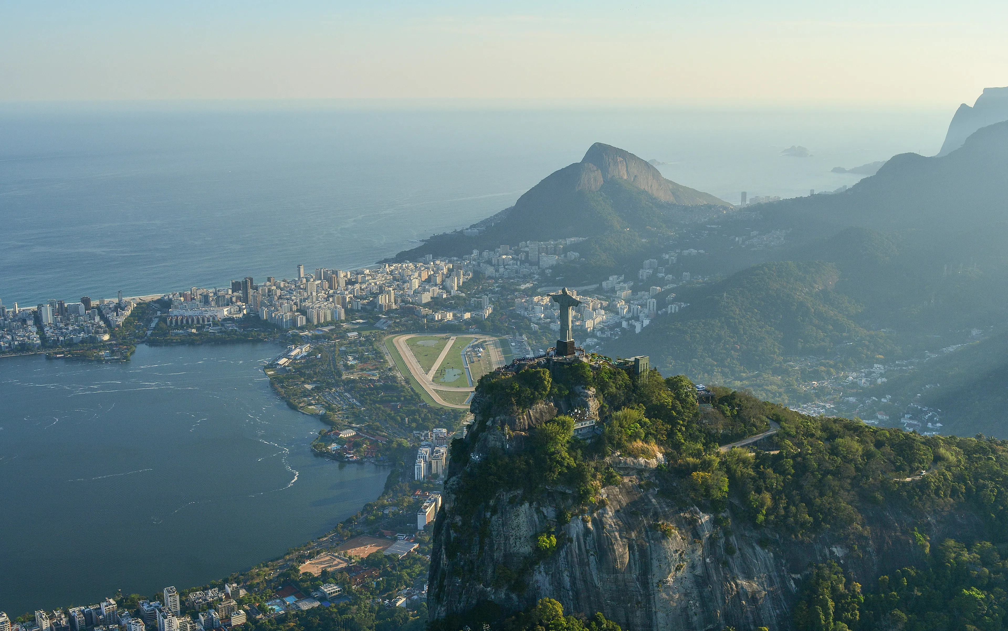Aerial view of Rio de Janeiro with the Christ the Redeemer statue, related to the official language of Brazil quiz question.