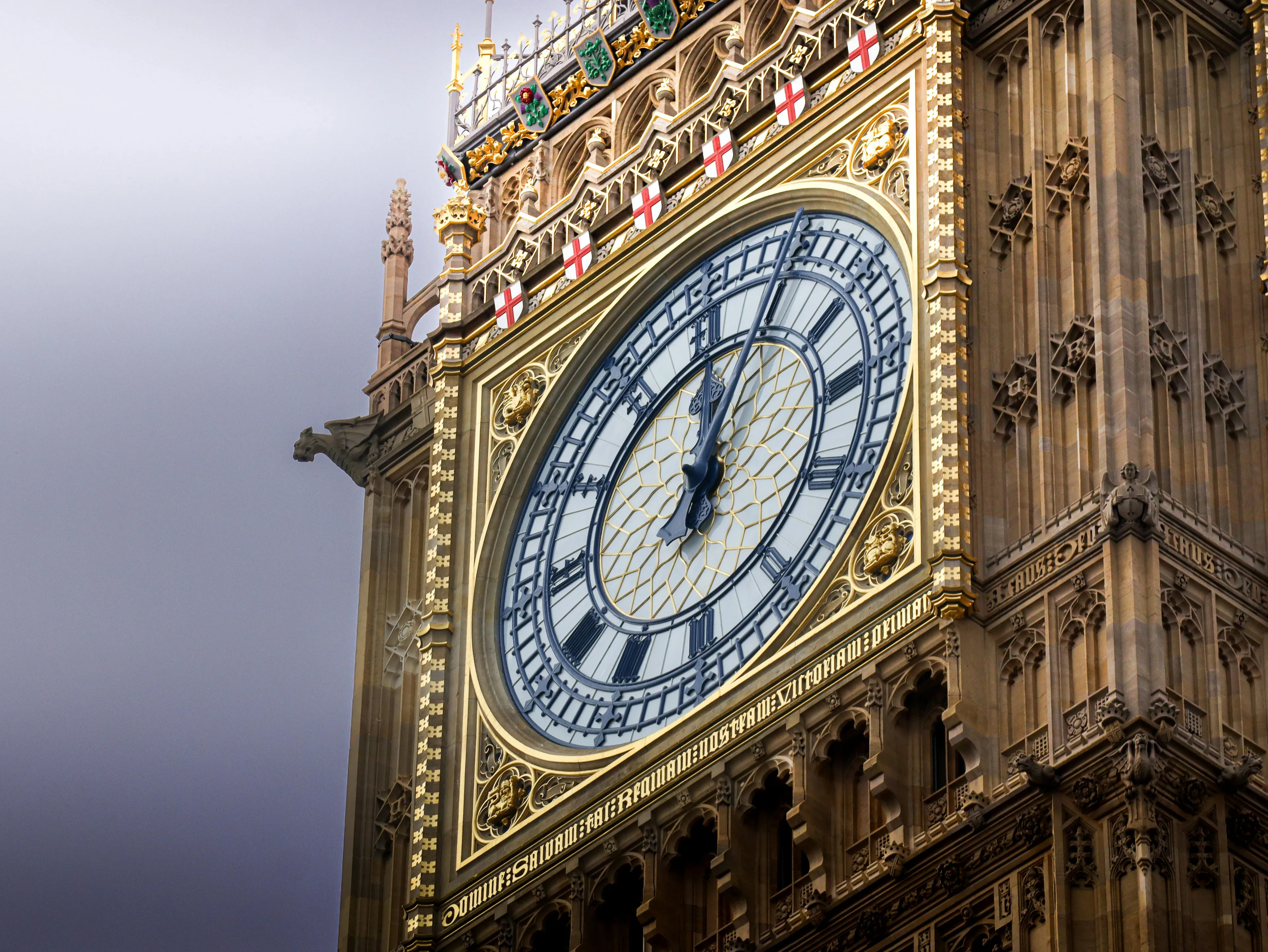 Close-up of the famous London clock tower known as Big Ben showing detailed clock face and ornate architecture.