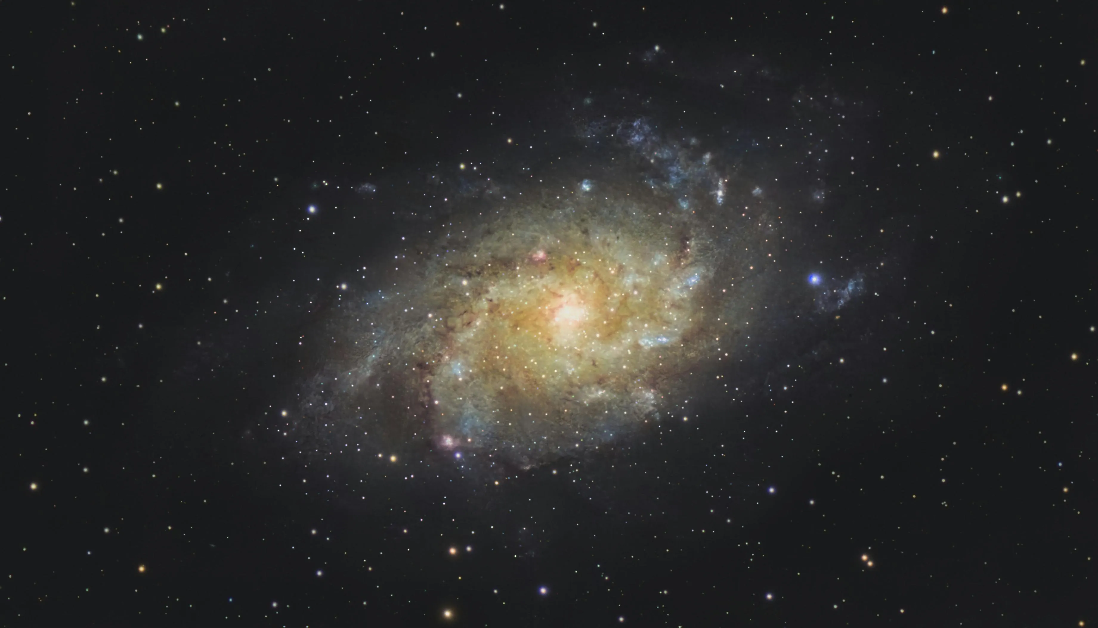 Spiral galaxy with glowing core and stars scattered around illustrating the galaxy we live in called the Milky Way.
