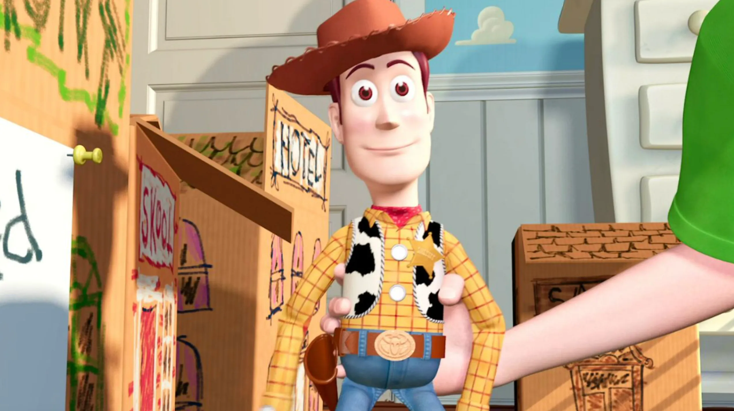 Woody cowboy doll from Toy Story standing in a room made of cardboard boxes for a pub quiz challenge.