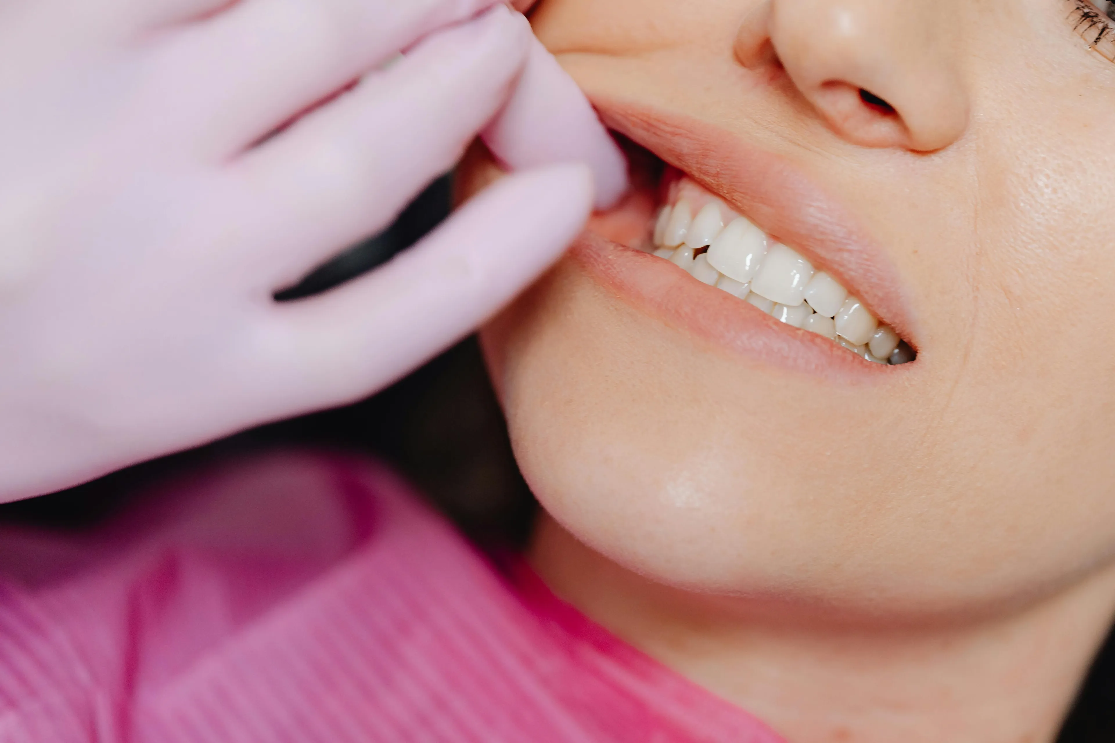 Close-up of a person’s teeth during dental exam, highlighting how many teeth an adult human typically has.