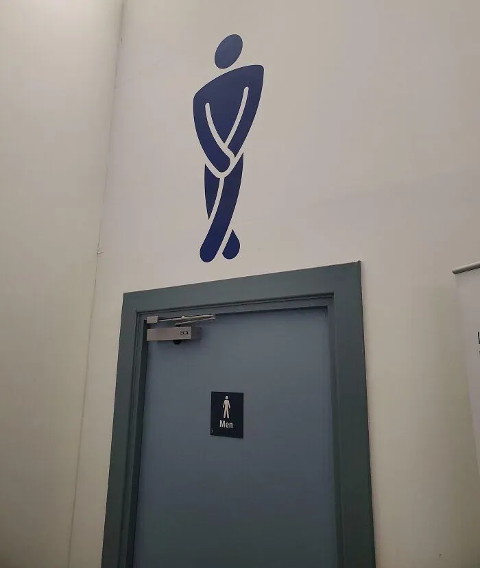 The Sign Above The Men's Toilets, Inverness Airport Departure Lounge