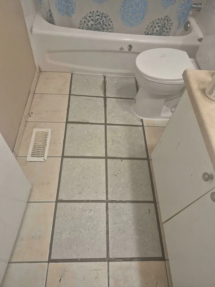 We Asked Our Landlord To Get Someone To Fix Our Bathroom Tiling. A Few Days Later, This Is The Result. Not Only Is The Caulk All Over The Place, But The Tiles Are The Wrong Size And Somehow The Wrong Colour