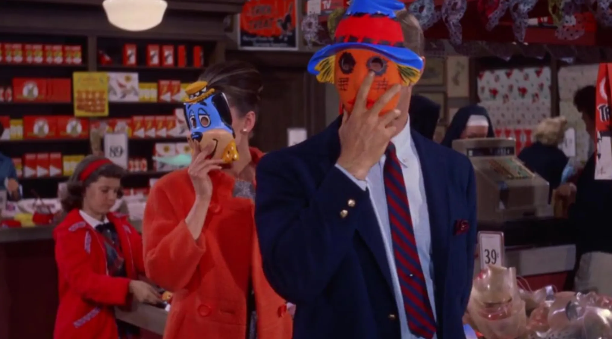 Two people wearing colorful masks in a vintage store scene from 60s movie scenes for guess the film.