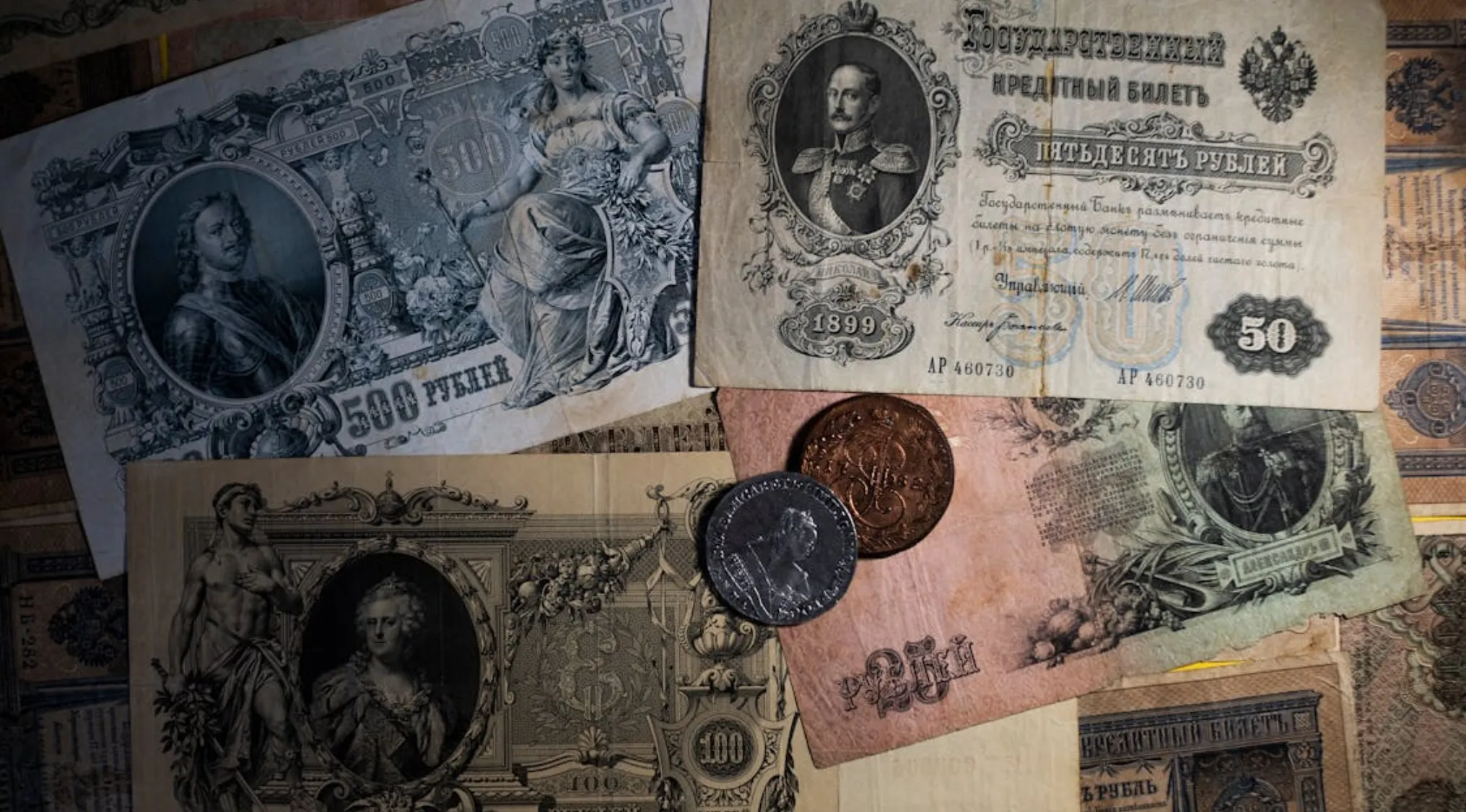 A collection of old banknotes and coins.