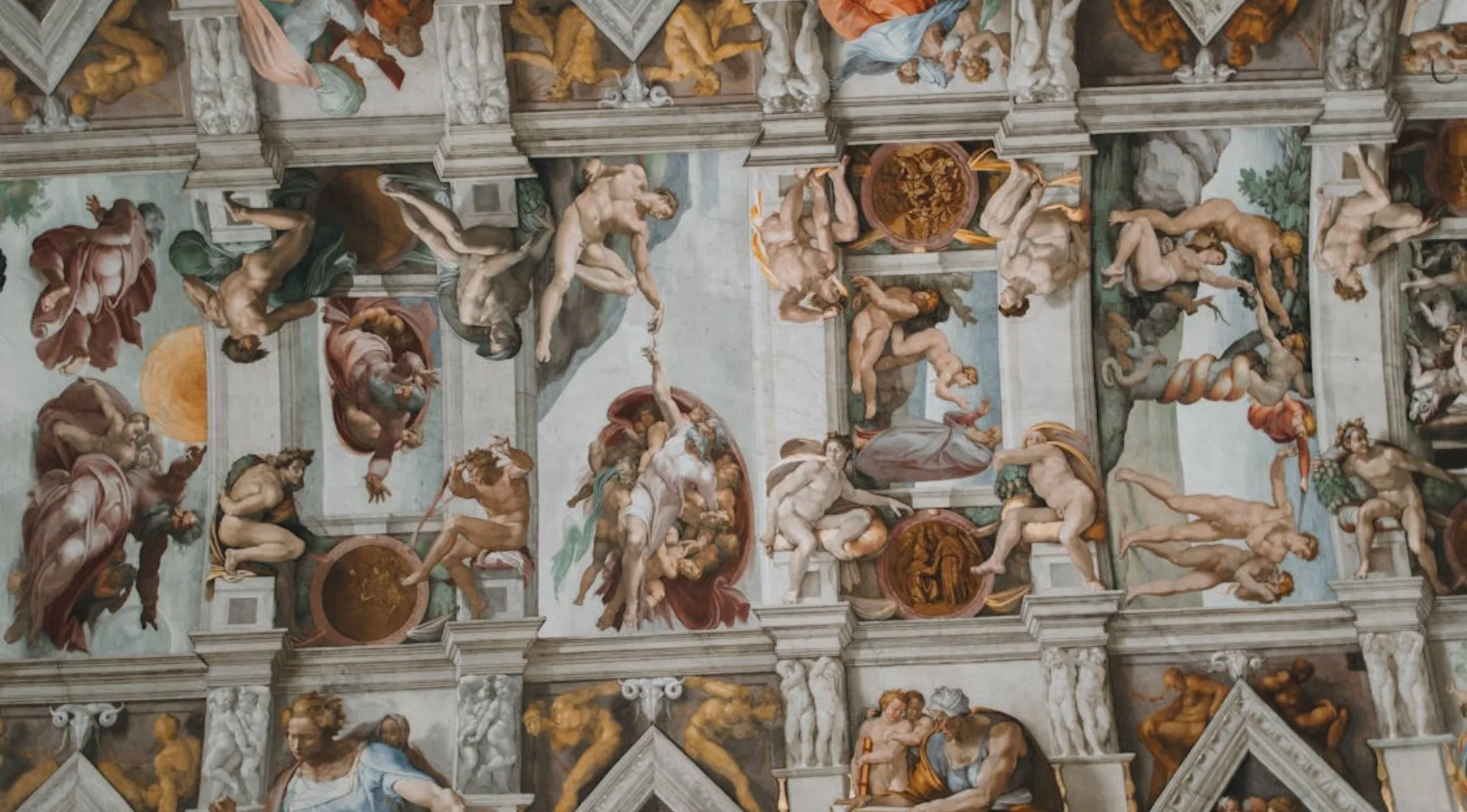 Sistine Chapel ceiling frescoes depicting biblical scenes painted in Vatican City.