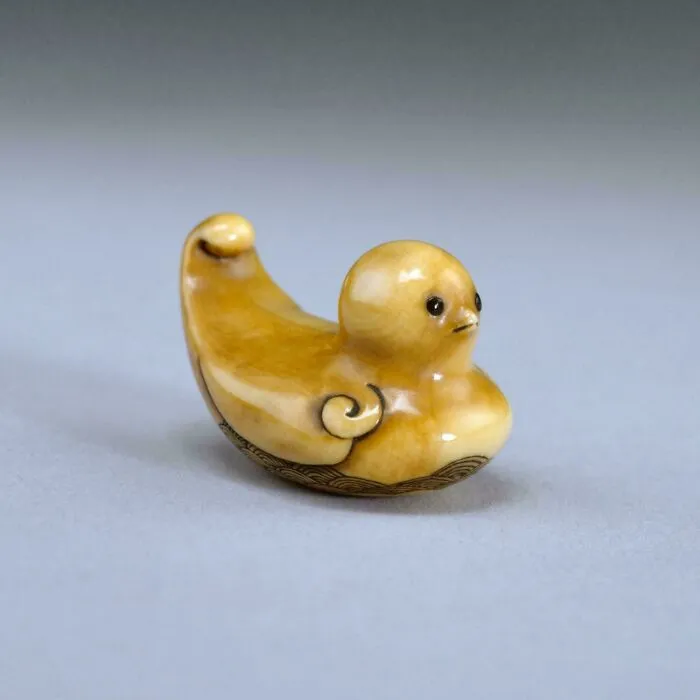 Small antique Japanese netsuke sculpture of a duck, showcasing unique historical finds