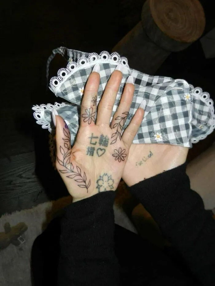 Ariana Grande’s Crusty Hand Tattoos