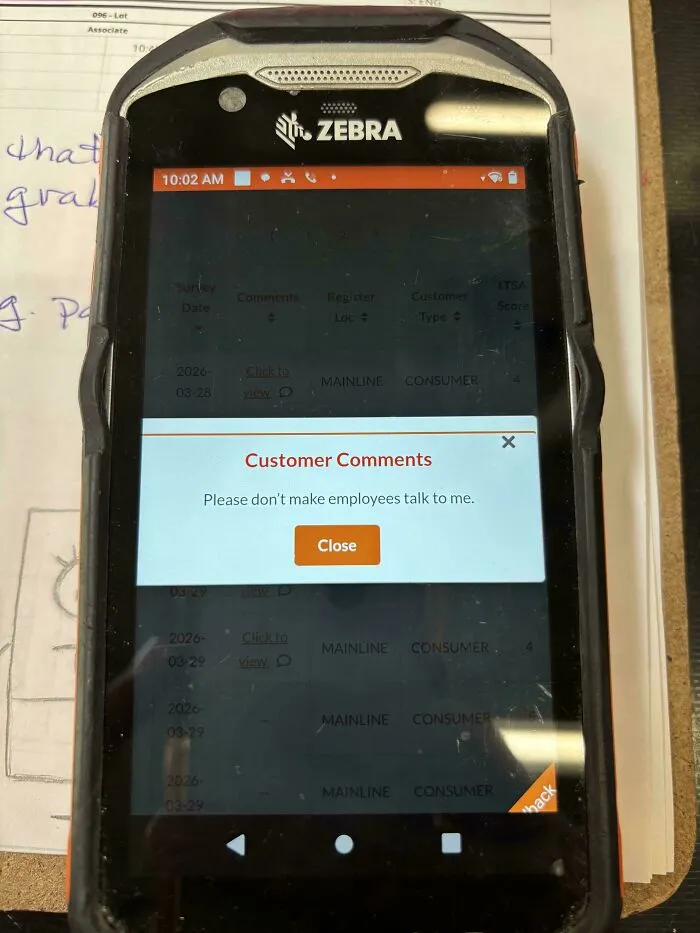 A zebra mobile device displaying a Home Depot customer feedback comment