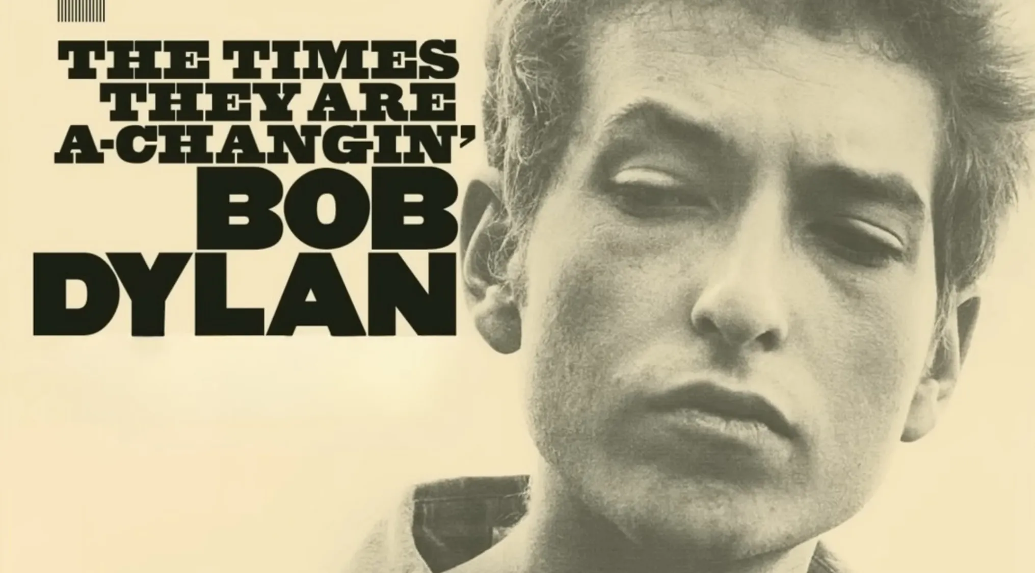 Close-up portrait of Bob Dylan with bold text of The Times They Are A-Changin in vintage style for sold items price guess.