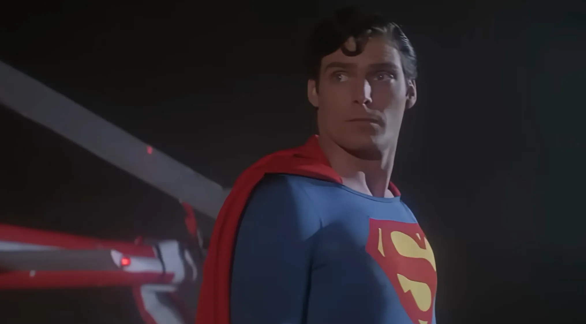Christopher Reeve's Superman costume from the original film series displayed with a sold price tag in 2007 auction.