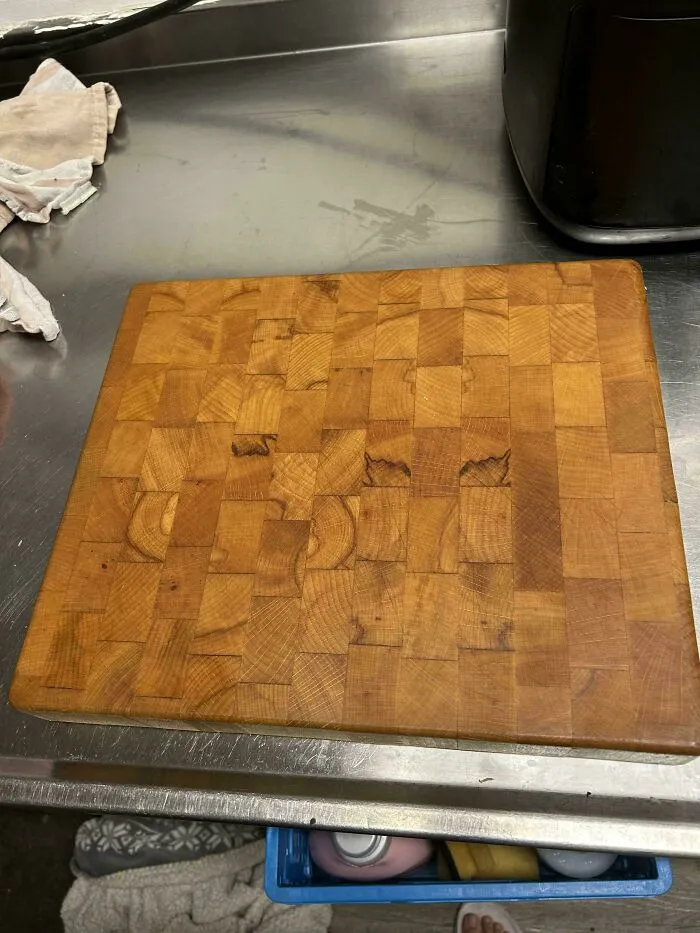 Well-maintained durable end-grain wooden cutting board representing old products that last through decades of daily use.