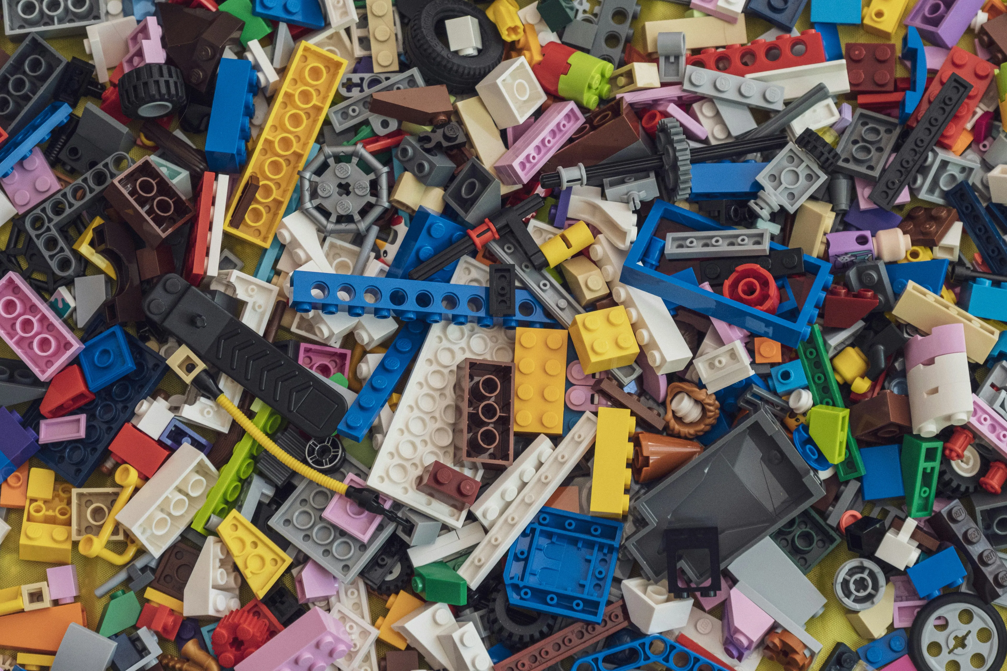 Colorful LEGO building blocks scattered as a creative and fun rainy-day activity for all ages indoors.
