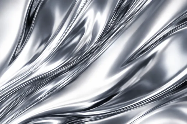 Abstract smooth silver metallic texture with flowing curves, reflecting light in a shiny liquid-like surface.