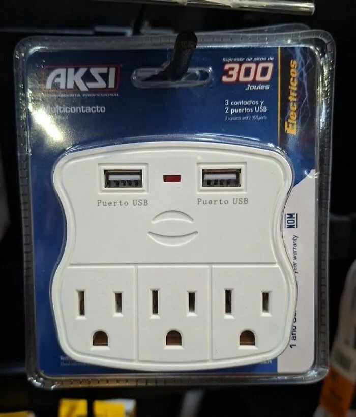 Power outlet and USB ports arranged to resemble a face, an example of pareidolia captured in a product photo.