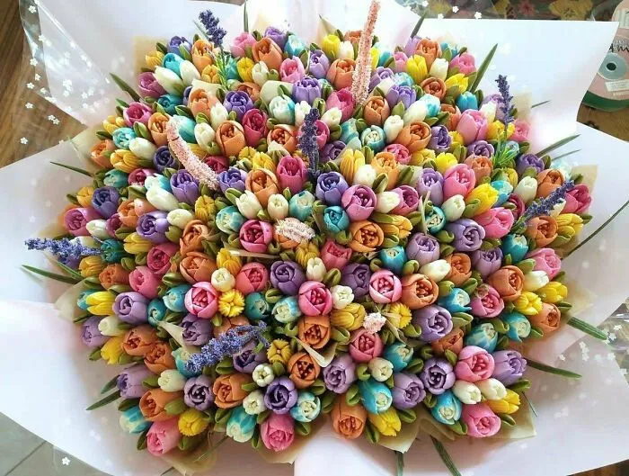 A 19 Cupcake Bouquet Covered In Bright Tulips. Delicate Hands Were Needed For This One!