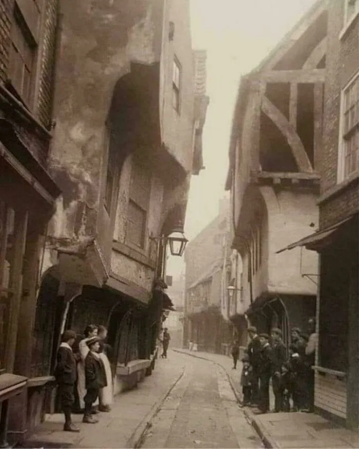 The Shambles In York, Pictured In 1900, Is Still One Of The Best-Preserved Medieval Shopping Streets In Europe. It's A Narrow Street Of Mostly Timber Buildings That Date Back As Far As The 13th Century