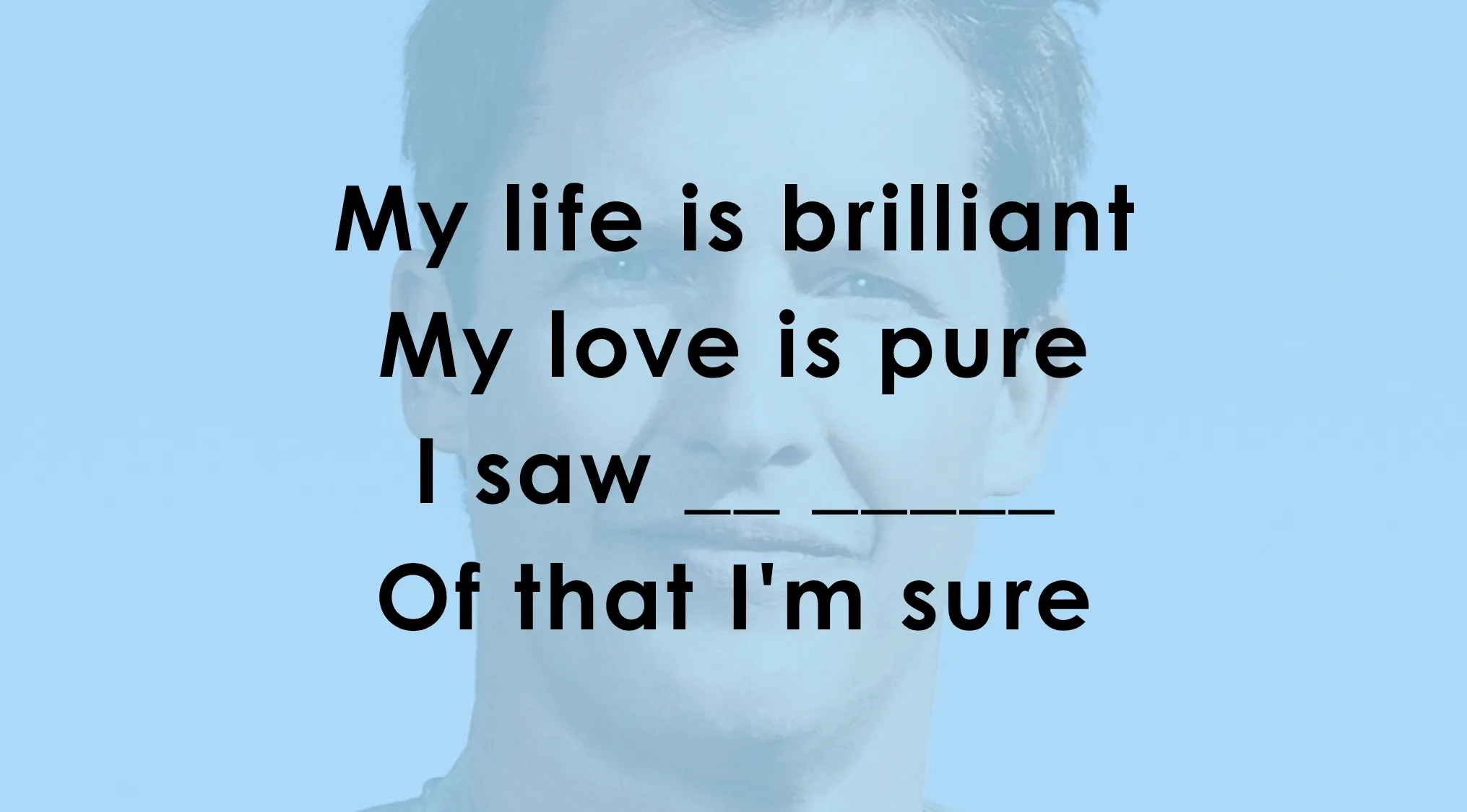Man's face in background with text challenging viewers to finish the lyrics in this song lyrics quiz.