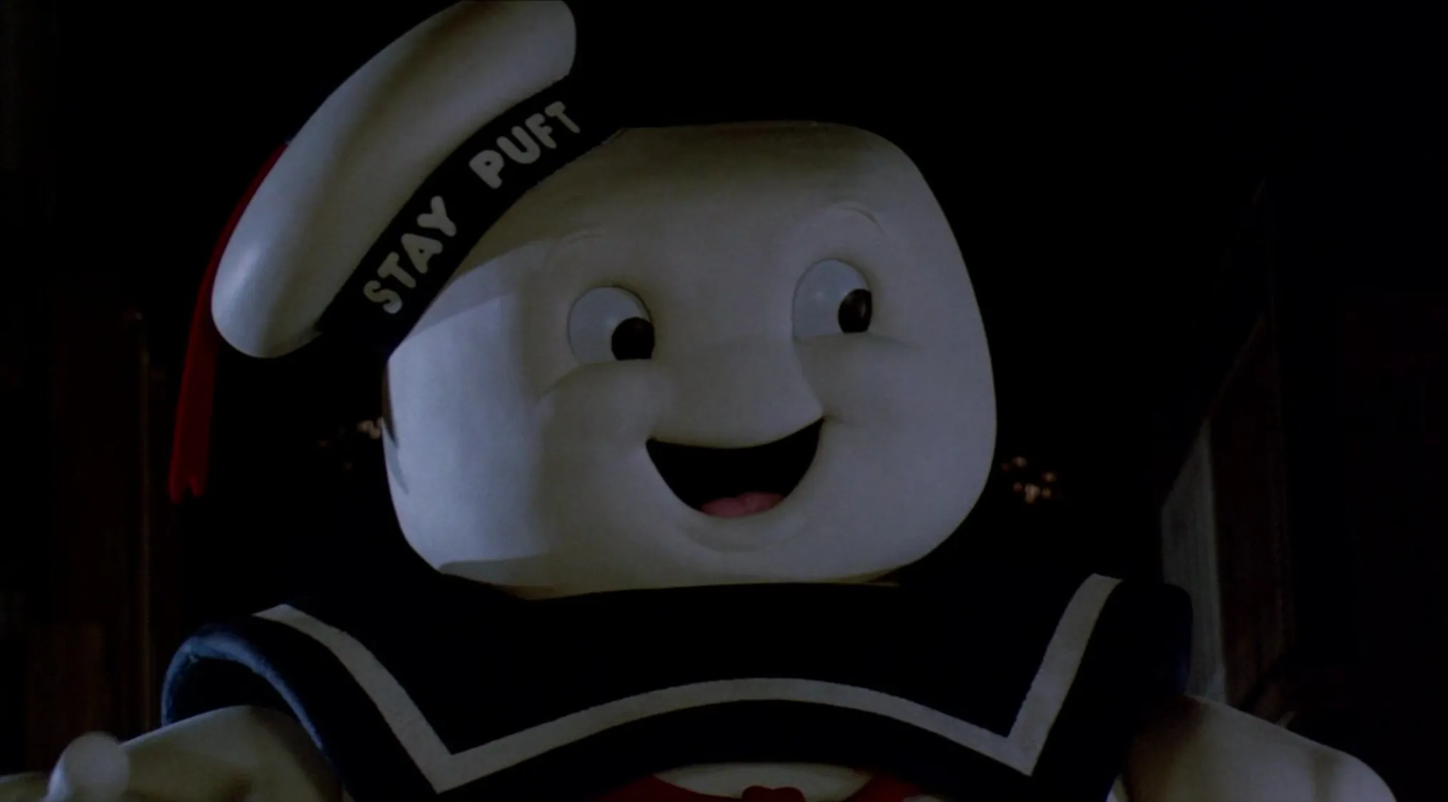 Stay Puft Marshmallow Man villain from '80s and '90s villains in a supernatural crisis scene at night.