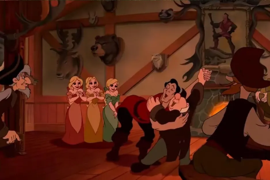 Villagers dancing cheerfully inside a rustic tavern from the animated Beauty and the Beast film.