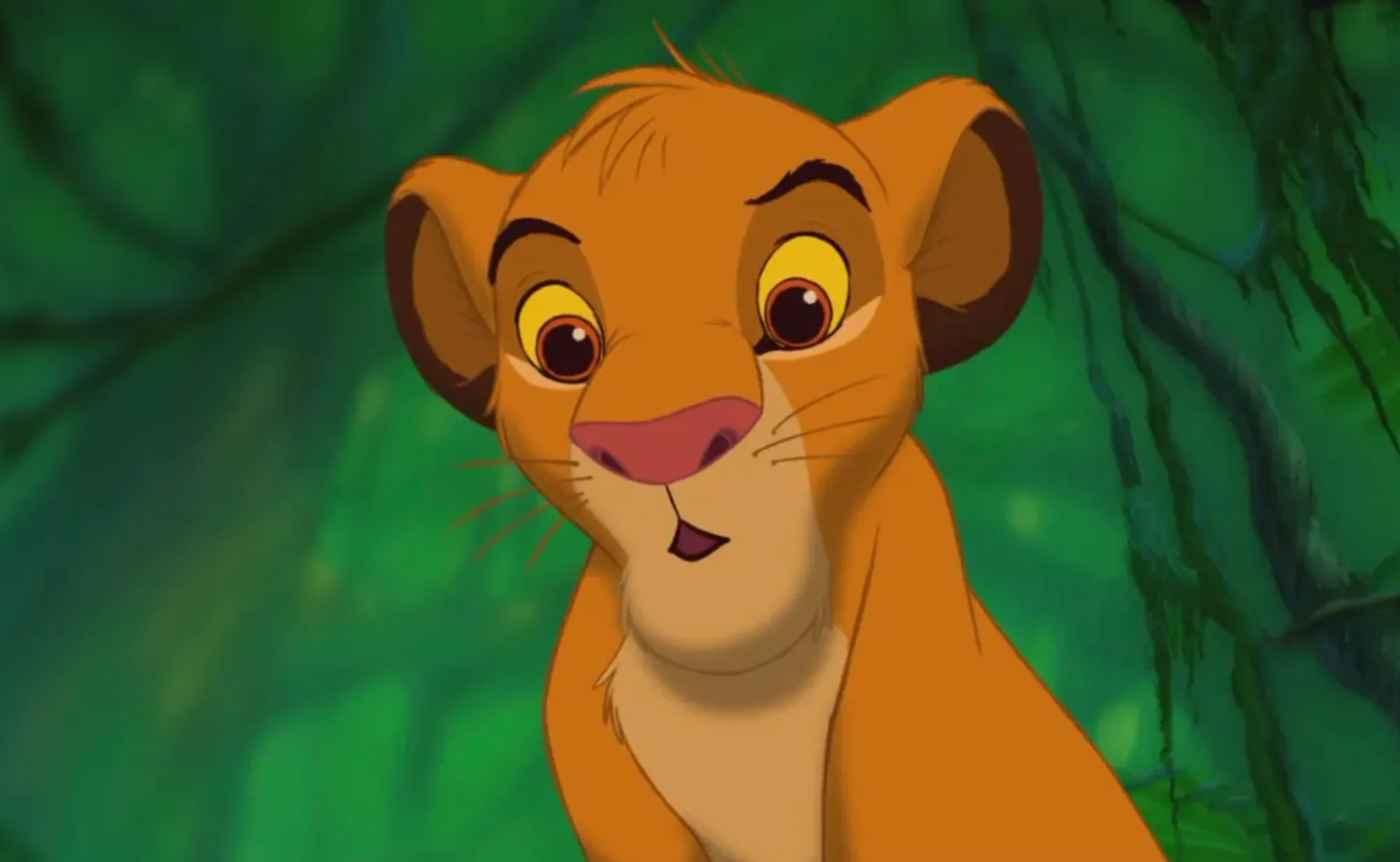 Young Simba from The Lion King looking curious in a lush green jungle setting from the animated movie.
