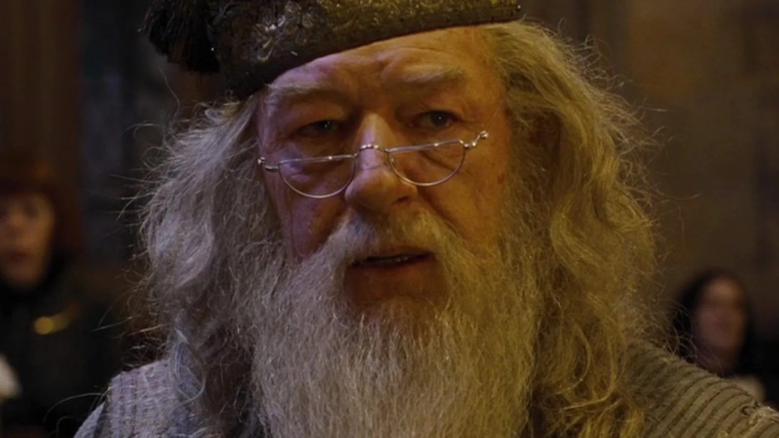 Dumbledore with long white beard and glasses in a magical setting, representing a fictional boss you'd want to work for.