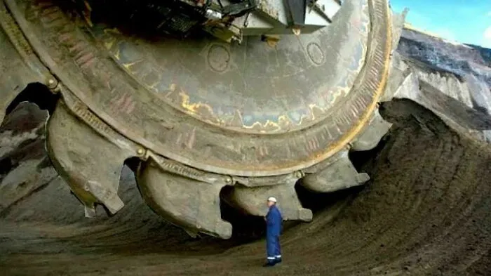 Mining Saw Blade Next To Person