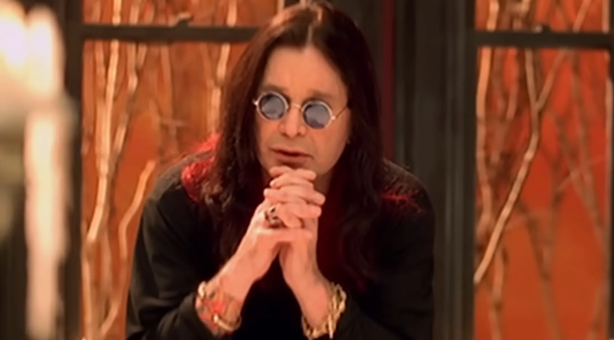 Ozzy Osbourne, lead singer and Prince of Darkness, in a close-up during a music challenge about bands and lead singers.