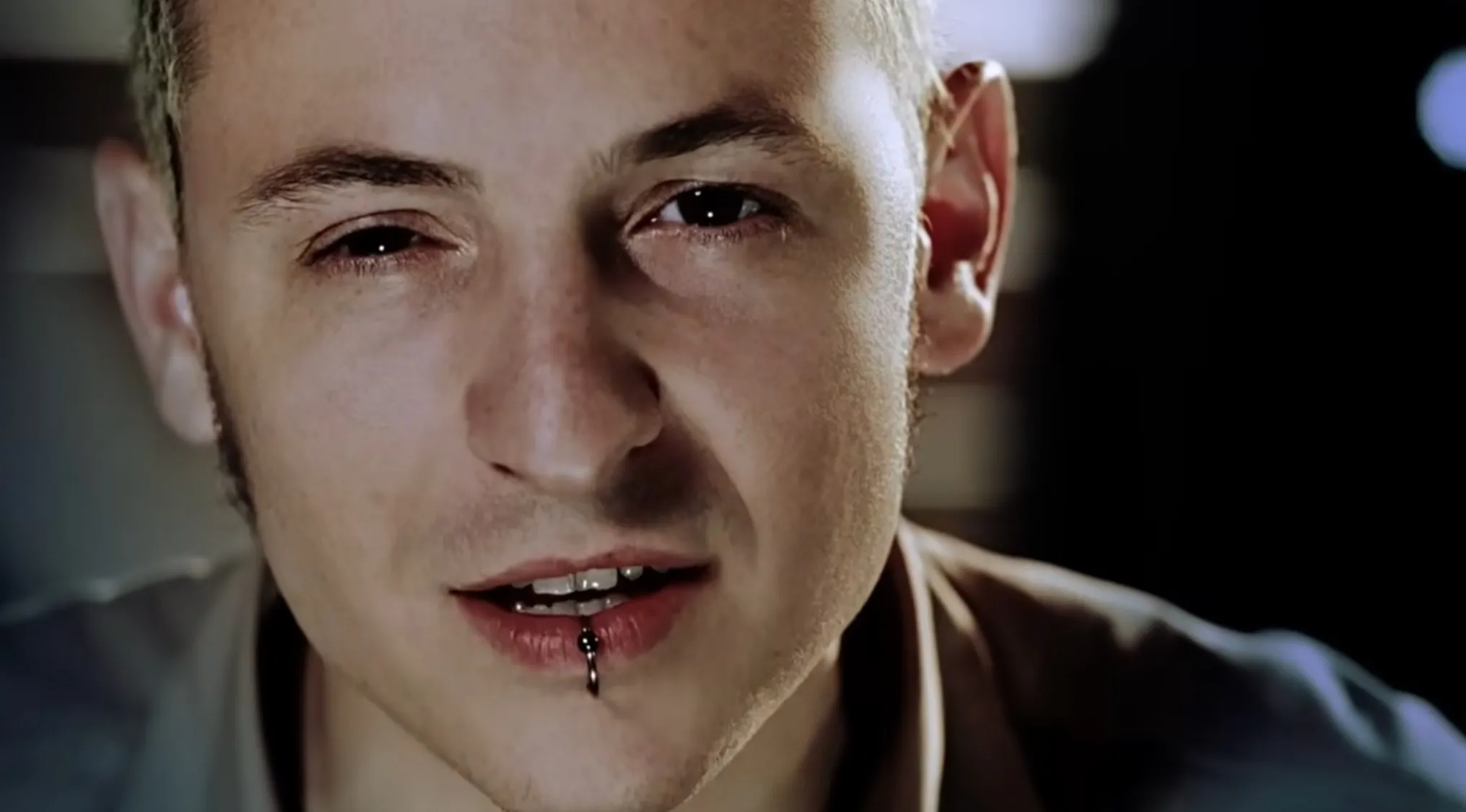 Close-up of a lead singer with a lip piercing, highlighting the music challenge of naming bands from lead singers.