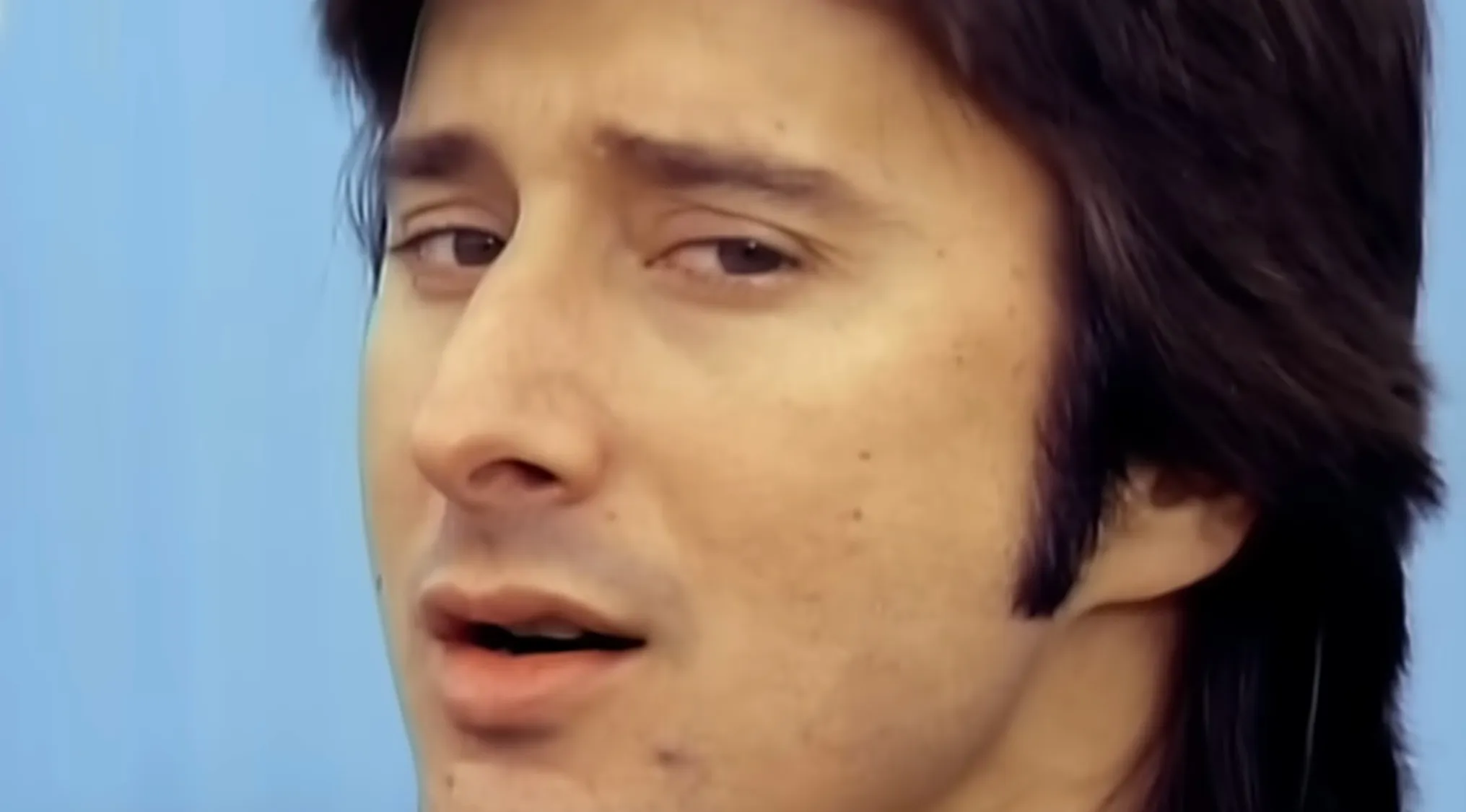 Close-up of a lead singer in the music challenge naming bands by connecting the lead singer to their band.
