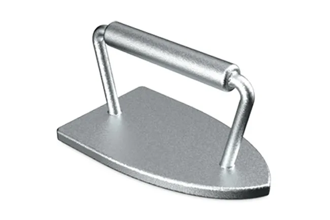 Silver Monopoly token shaped like a classic iron with a flat base and a curved handle on a white background