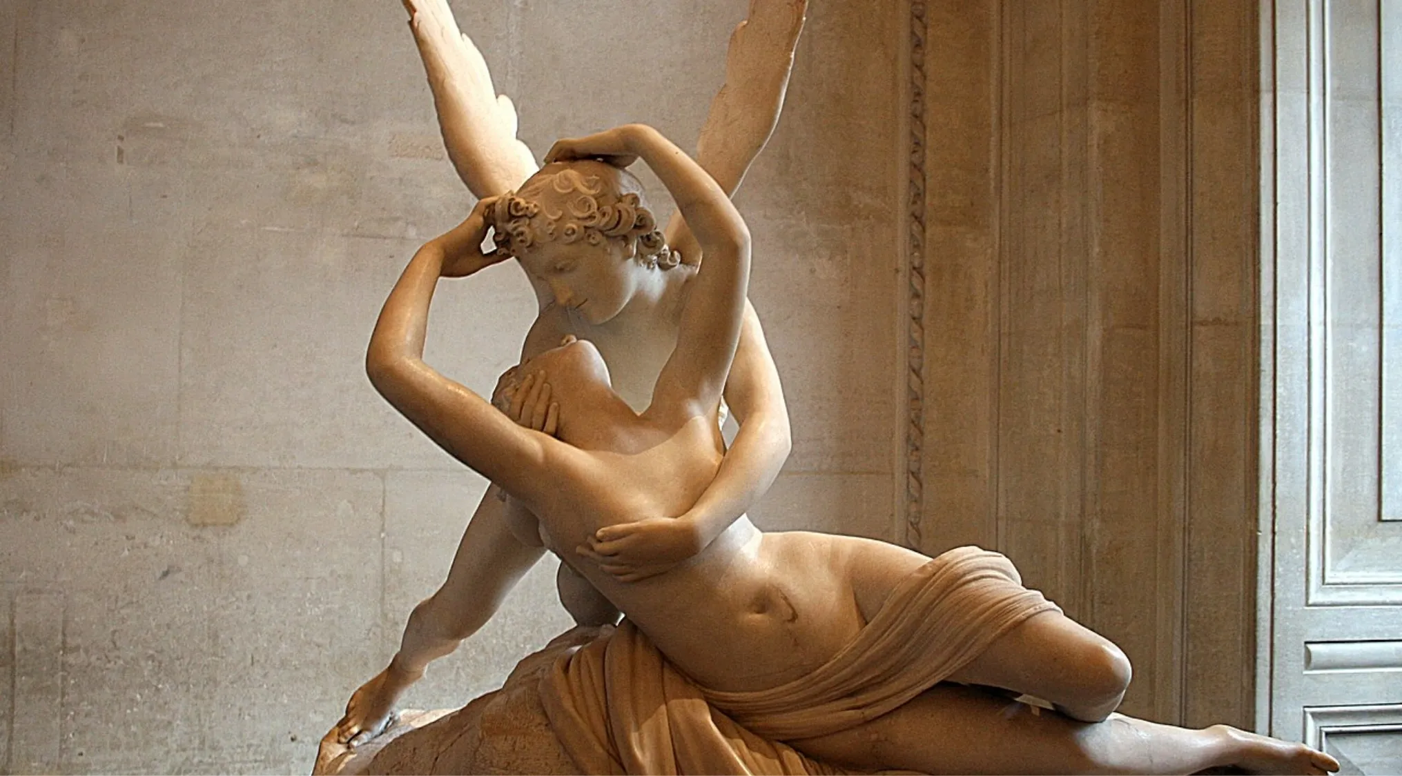 Marble sculpture Psyche Revived by Cupid's Kiss showcasing romantic expressions from the Neoclassical art period.