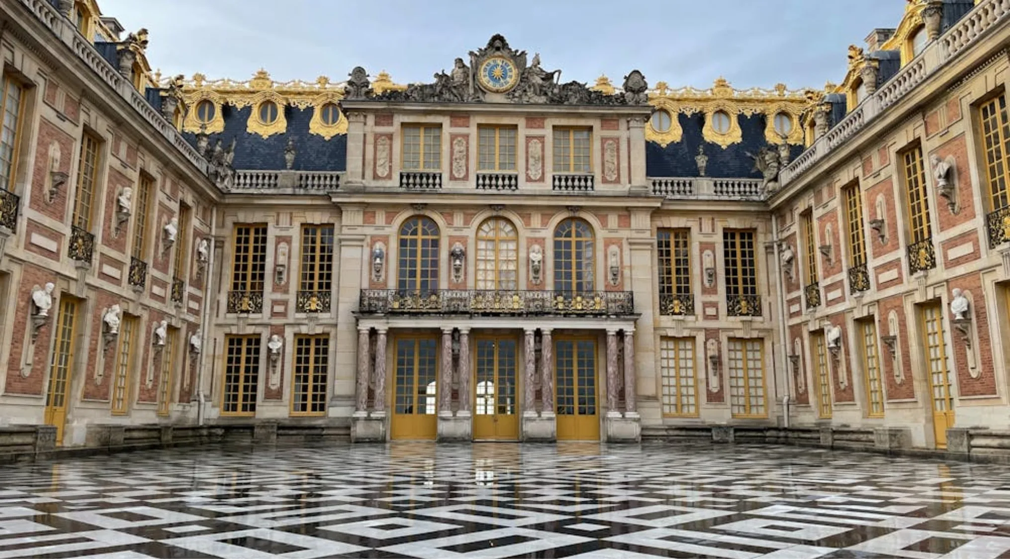 Palace of Versailles exterior showing grand scale, axial planning, and dramatic use of space in Baroque art period style.