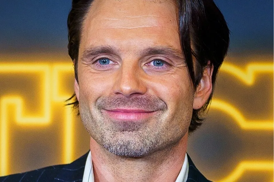Sebastian Stan smiling at an event with blue eyes and dark hair, not part of the cast of The Martian.