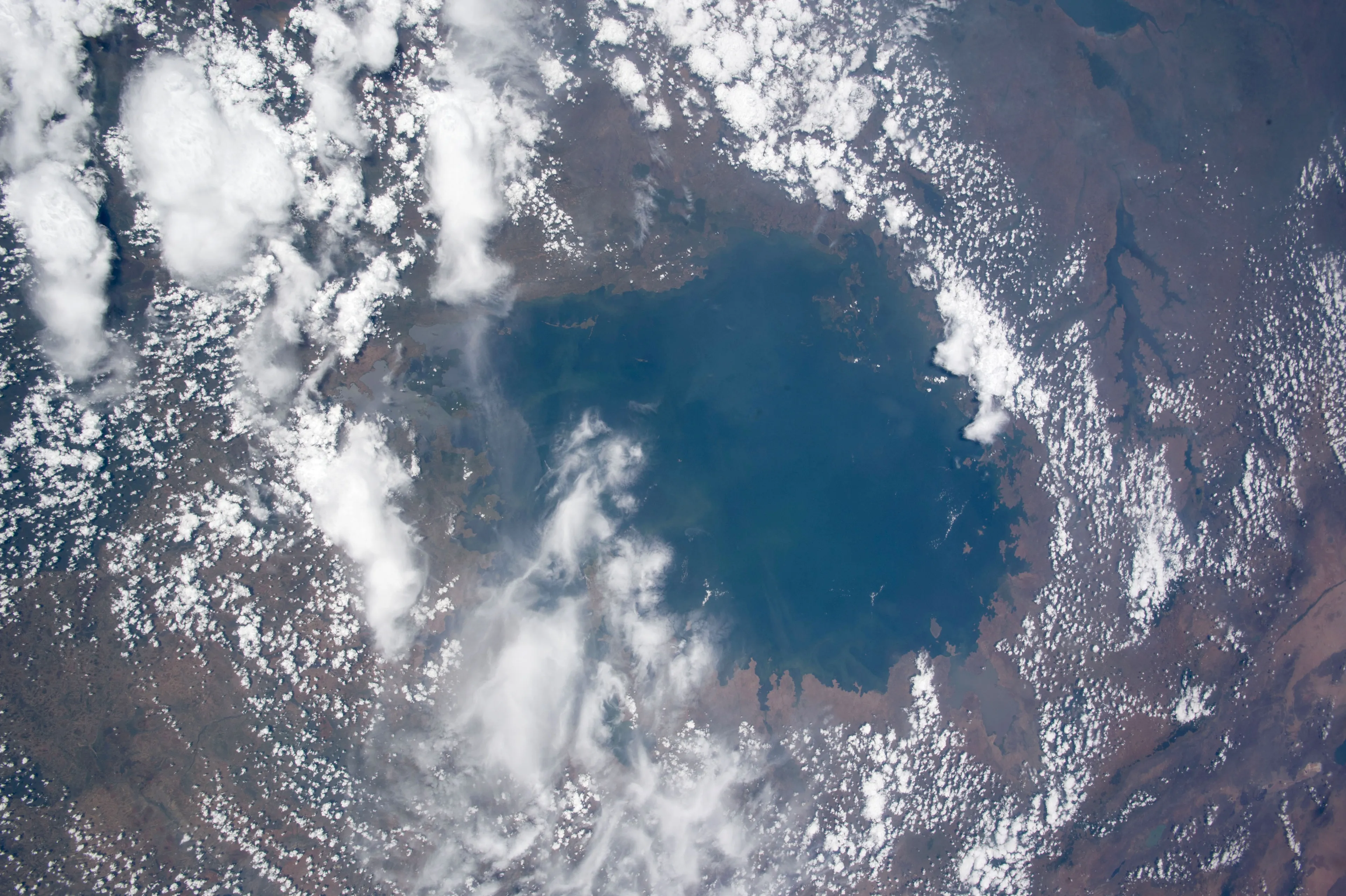 Aerial view of Lake Victoria surrounded by clouds and land, part of a difficult general knowledge quiz for high IQs.