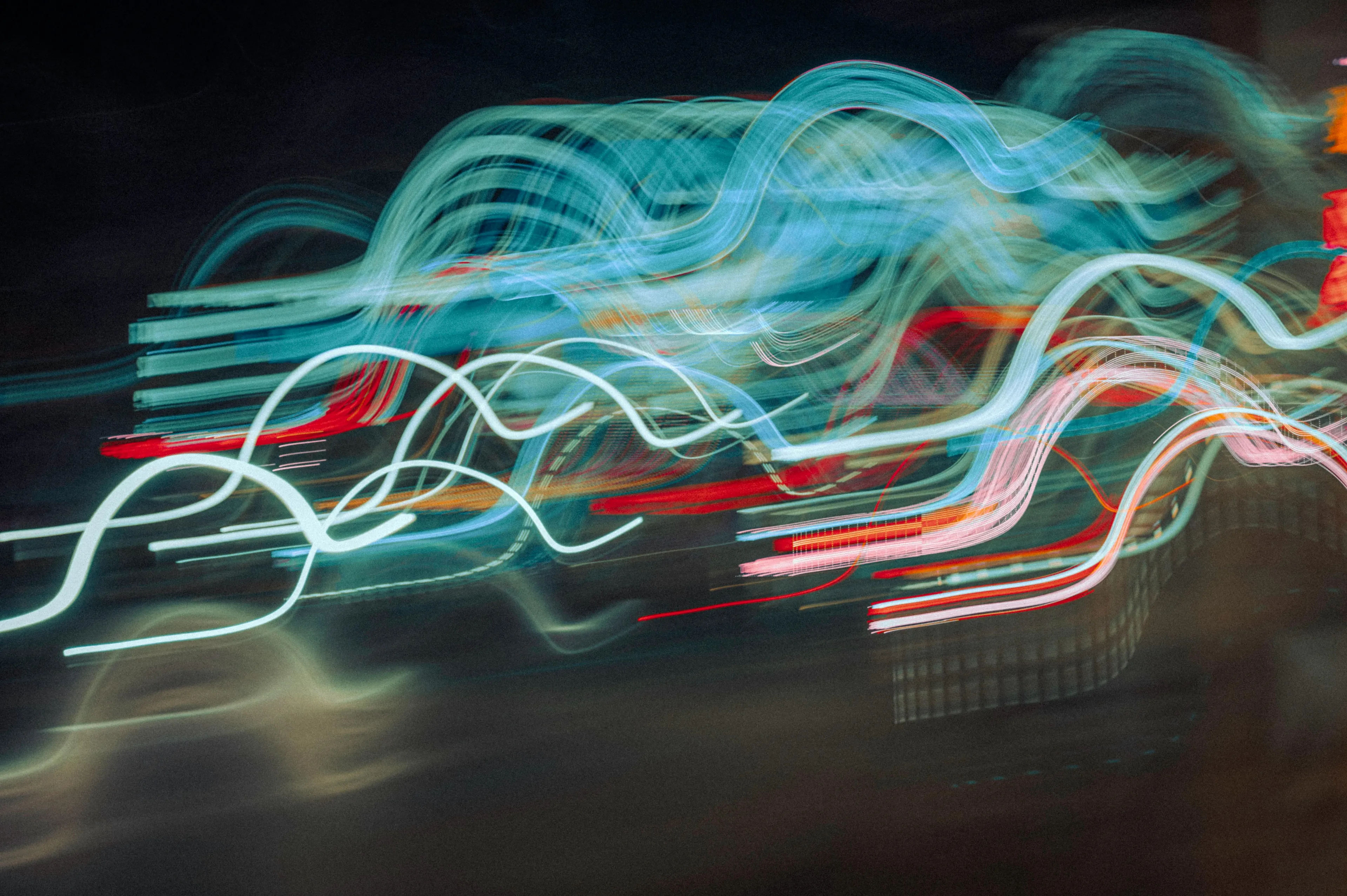 Abstract light waves with bending patterns representing the bending of waves when passing from one medium to another.