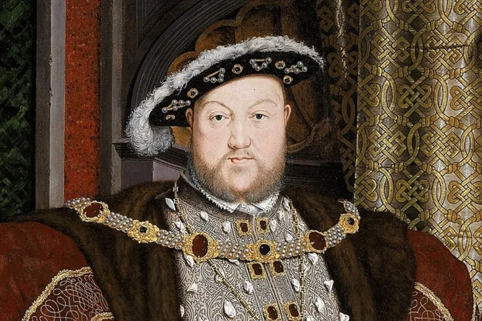 Portrait of King Henry VIII wearing royal attire and jeweled chain, symbolizing the longest-reigning British monarch before Elizabeth II.
