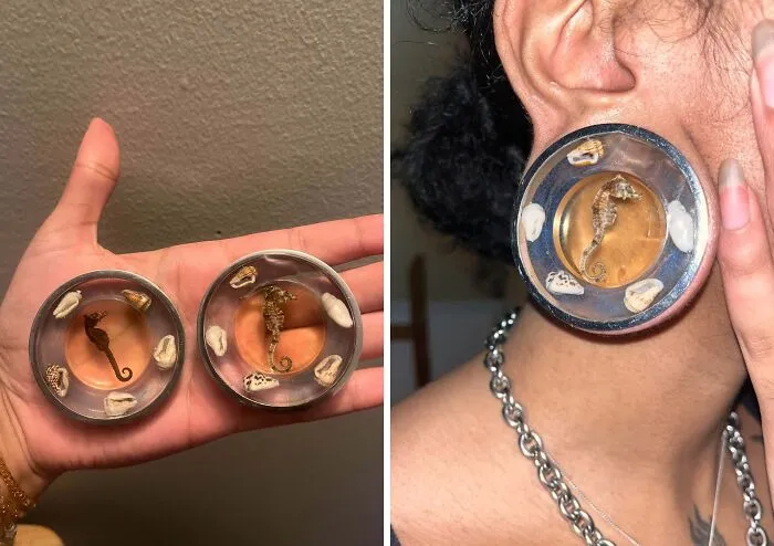 A person holding and wearing creative earrings featuring a seahorse and seashells encased in resin. Artistic trash into useful jewelry.