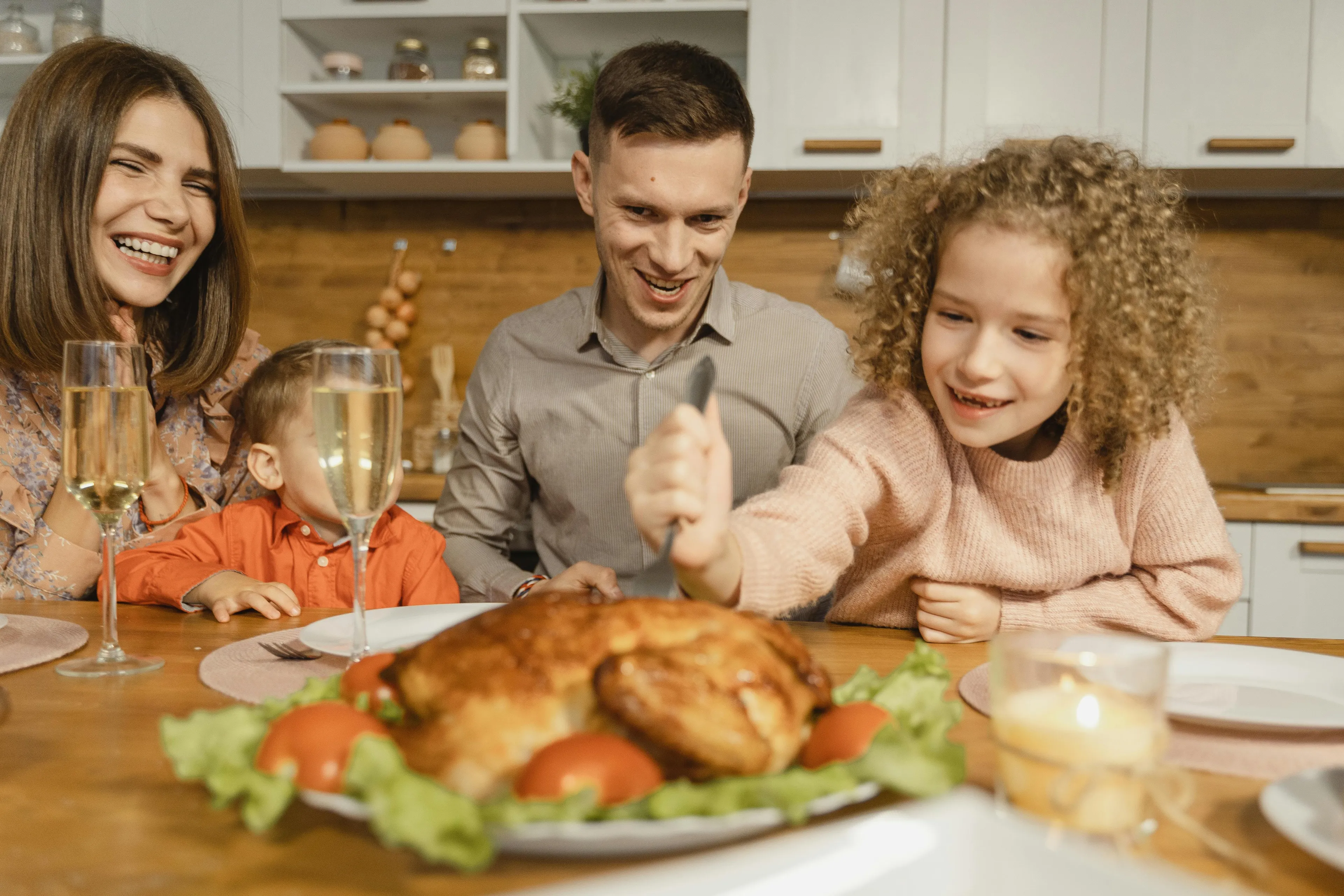 Family dinner with kids enjoying a meal together, smiling and sharing quality time around the table.