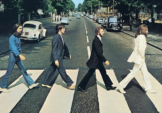The Beatles crossing Abbey Road, iconic parenting playlist anthem inspiration for all you need is love fans.