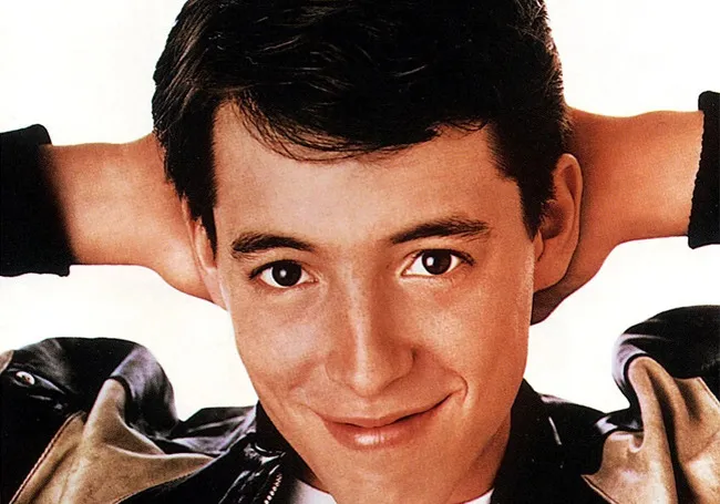 Close-up of a young man smiling and relaxing, suggesting Ferris Bueller's Day Off as a movie to watch with family.
