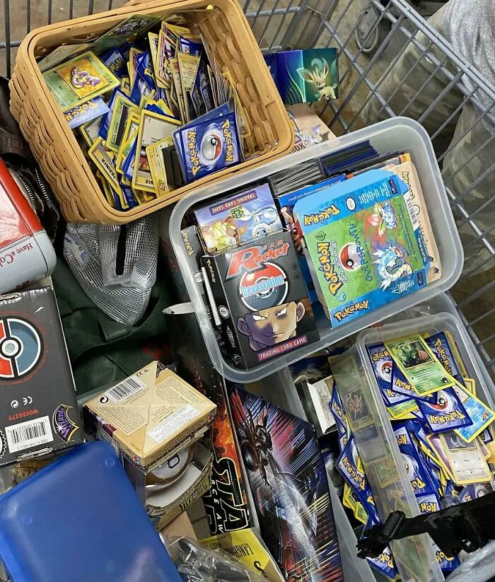 Pokemon cards and game boxes found in Goodwill bins, a surprising discovery among other items.