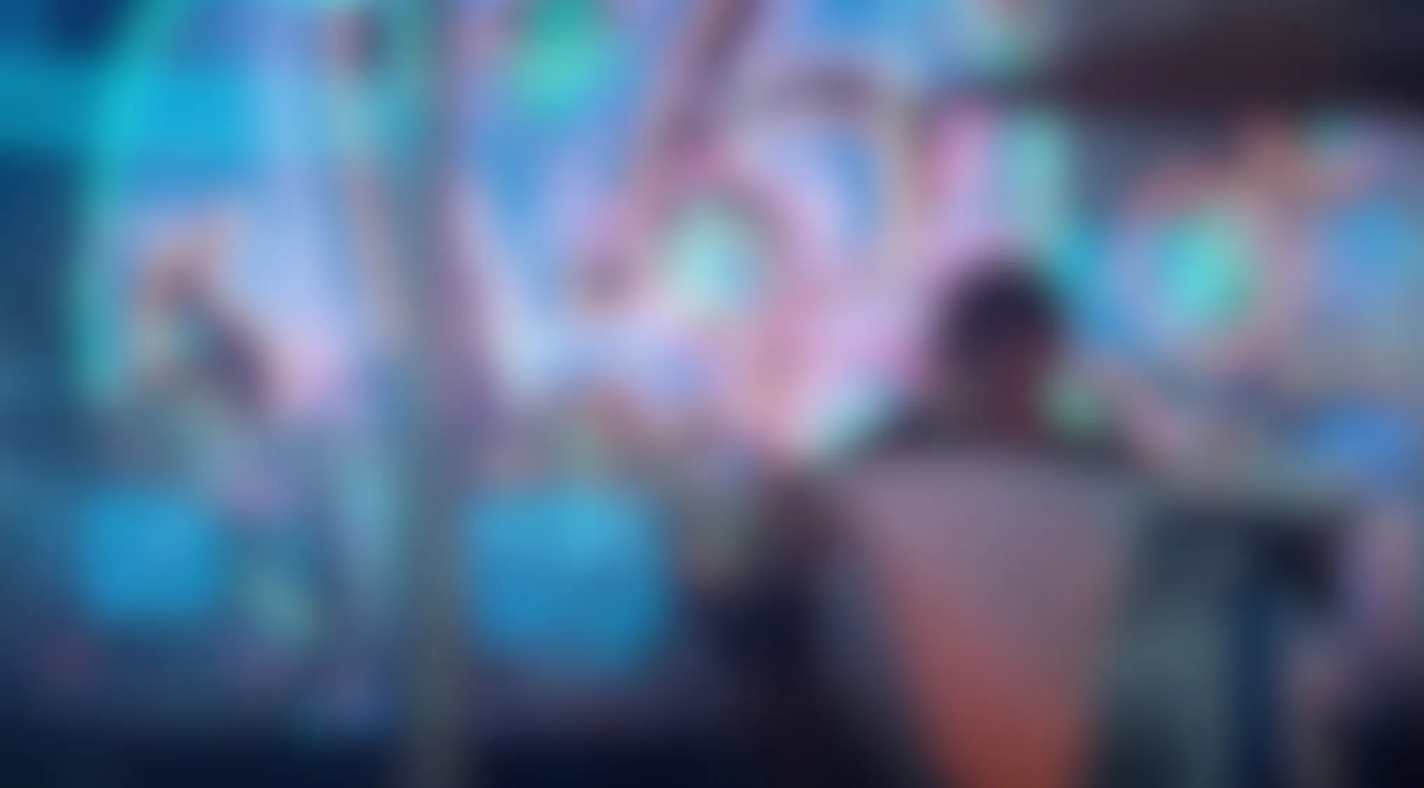 Blurry Movie Scenes: A figure stands amidst vibrant, abstract lights in Blade Runner (1982).